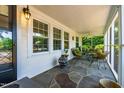 Relaxing screened porch featuring stone flooring and comfortable seating at 2725 Bedford Ave, Raleigh, NC 27607