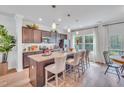 Spacious kitchen with granite countertops, stainless steel appliances, and a large island with barstool seating at 287 Alice Trace Place, Angier, NC 27501