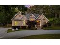Beautiful two story home with brick facade and manicured front lawn at 308 Thomas Dr, Clayton, NC 27520