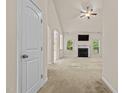 Bright living room featuring a fireplace, ceiling fan, and lots of natural light at 309 Coachman'S Trl, Stem, NC 27581