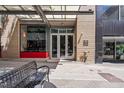 Building entrance featuring a covered walkway, glass doors, and brick facade at 319 Fayetteville St, Raleigh, NC 27601