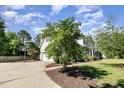 Two-story home with attached garage, basketball hoop, and a well-manicured lawn and landscaping at 4117 Stansted Dr, Fuquay Varina, NC 27526
