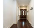Grand foyer featuring hardwood floors, decorative lighting, and a stunning front door at 4143 Gardenlake Dr, Raleigh, NC 27612
