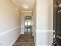 Inviting hallway with wood floors and decorative moldings, leading to various rooms in the home at 43 Jonalker Ct, Clayton, NC 27520
