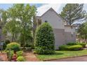 The exterior shows a well maintained building with trees and shrubbery, plus a fire hydrant at 600 Audubon Lake Dr # 6B13, Durham, NC 27713