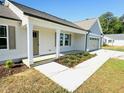 Charming home showcasing a welcoming covered front porch at 71 Earnest Way, Kenly, NC 27542