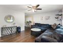 Comfortable living room featuring a sectional sofa, decorative console table, and stylish round coffee table at 901 Currin Perry Rd, Zebulon, NC 27597