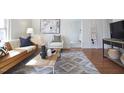 Inviting living room featuring modern décor, stylish furniture, and hardwood floors at 913 Washington St, Durham, NC 27701