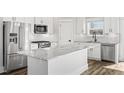 Modern kitchen with stainless steel appliances, a large island, and granite countertops, perfect for cooking at 1009 Rhino Bnd, Oxford, NC 27565