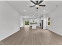 Open-concept living space featuring wood floors, stainless steel appliances, and lots of natural light at 1009 Rhino Bnd, Oxford, NC 27565