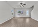 Spacious living room featuring hardwood floors, large windows, and an open layout at 1009 Rhino Bnd, Oxford, NC 27565