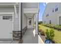 Inviting townhouse entrance with well-kept landscaping and visible house number at 1011 Canary Pepper Dr, Durham, NC 27713