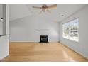 Bright living room boasting hardwood floors, a cozy fireplace, and lots of natural light at 1040 Mills St, Raleigh, NC 27608