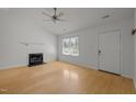 Sunlit living room features a fireplace and inviting entry at 1040 Mills St, Raleigh, NC 27608