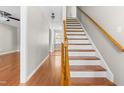 View of the home's staircase and hardwood floors at 105 Kirkland Ct, Archer Lodge, NC 27527