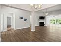 Spacious open-concept living area with hardwood floors and fireplace at 11 Woodwater Cir, Lillington, NC 27546