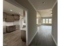 Hallway view of an open-concept home showing the kitchen and living room at 112 Royal Ave, Selma, NC 27576