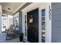 Close-up of the front door, sidelights, and house number 1223 at 1223 Brown Velvet Ln, Apex, NC 27523