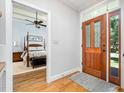 Entryway with hardwood floors and a view of the main bedroom at 12733 Pamplona Dr, Wake Forest, NC 27587