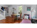 Inviting dining area featuring hardwood floors, natural light, and a cozy setup for Gathering meals at 1314 Glendale Ave, Durham, NC 27701
