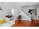 Cozy living room with hardwood floors, staircase and ample seating space for entertaining guests or relaxing at 1314 Glendale Ave, Durham, NC 27701