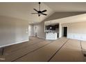 Open-concept living room featuring modern finishes and seamless transitions to the kitchen area at 134 Royal Ave, Selma, NC 27576