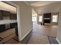 Spacious living room with a fireplace and mantel, open floor plan to kitchen at 134 Royal Ave, Selma, NC 27576