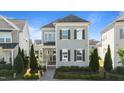 Charming two-story home with beautiful landscaping and a welcoming front porch at 1641 Silo Ridge Dr, Wake Forest, NC 27587