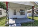 A close-up of the home's entry, featuring charming decorative iron porch posts at 215 N 4Th St, Smithfield, NC 27577