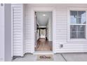 Inviting entryway featuring a Mungo Homes welcome mat and wood-look flooring at 22 Sagamore Avenue, Angier, NC 27501