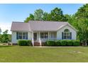 Lovely single-story home offering a well-kept lawn and attractive curb appeal at 318 Duck Pond Ln, Clayton, NC 27520