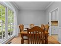 Classic dining room with a large window and light-colored walls, perfect for Gathering gatherings at 3401 Scotch Dr, Raleigh, NC 27616
