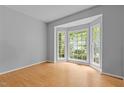 Bright room with bay window, hardwood floors and neutral wall paint at 3401 Scotch Dr, Raleigh, NC 27616