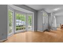 Bright living room featuring a bay window offering great natural light and hardwood floors at 3401 Scotch Dr, Raleigh, NC 27616