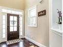 Welcoming foyer with hardwood floors, natural light, and elegant details at 497 Rockport Dr, Clayton, NC 27527
