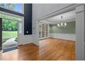 Open foyer with wood floors, natural light, and views into the adjacent living spaces at 541 The Preserve Trl, Chapel Hill, NC 27517