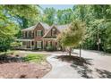 Charming brick home with landscaped yard, long driveway, and basketball court at 5601 Jomali Dr, Durham, NC 27705