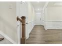 Bright foyer with hardwood floors, white trim, and a welcoming view of the front door at 605 Hampton Crest Ct, Fuquay Varina, NC 27526