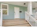 Close-up of the front porch with white railings and natural wood steps at 610 N Driver St, Durham, NC 27703