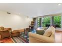 Cozy living room with a comfortable seating area, hardwood floors, and a bright view to the balcony at 620 Martin Luther King Jr Blvd # Apt 502, Chapel Hill, NC 27514