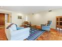Spacious living area featuring hardwood flooring, neutral walls, and a cozy seating arrangement at 620 Martin Luther King Jr Blvd # Apt 502, Chapel Hill, NC 27514