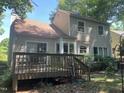 A spacious backyard with a wooden deck for outdoor seating and entertaining at 713 Beddingfield Dr, Knightdale, NC 27545
