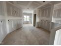 Unfinished open-concept living space boasts natural light and endless possibilities at 94 Royal Ave, Selma, NC 27576