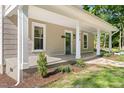 Inviting covered front porch with classic columns and a cozy outdoor space at 1010 Cobb St, Durham, NC 27707