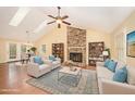 Spacious living room with vaulted ceilings, brick fireplace and built-in bookshelves at 1015 Boathouse Ct, Raleigh, NC 27615
