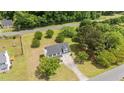 Spacious home with a large, private yard, complemented by mature trees and a long driveway at 114 Lynnville Ct, Lillington, NC 27546
