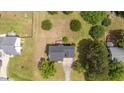 Well-situated home with ample yard space, mature trees, and a long driveway at 114 Lynnville Ct, Lillington, NC 27546