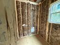 Bathroom framing with insulation, utility connections, and window, ready for finishing touches at 13159 S Nc-231 Hwy, Middlesex, NC 27557