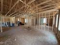 Interior view of new home construction shows framing, open floor plan, trusses at 13159 S Nc-231 Hwy, Middlesex, NC 27557
