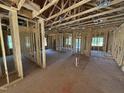 Spacious living room with exposed framing and windows providing natural light at 13159 S Nc-231 Hwy, Middlesex, NC 27557